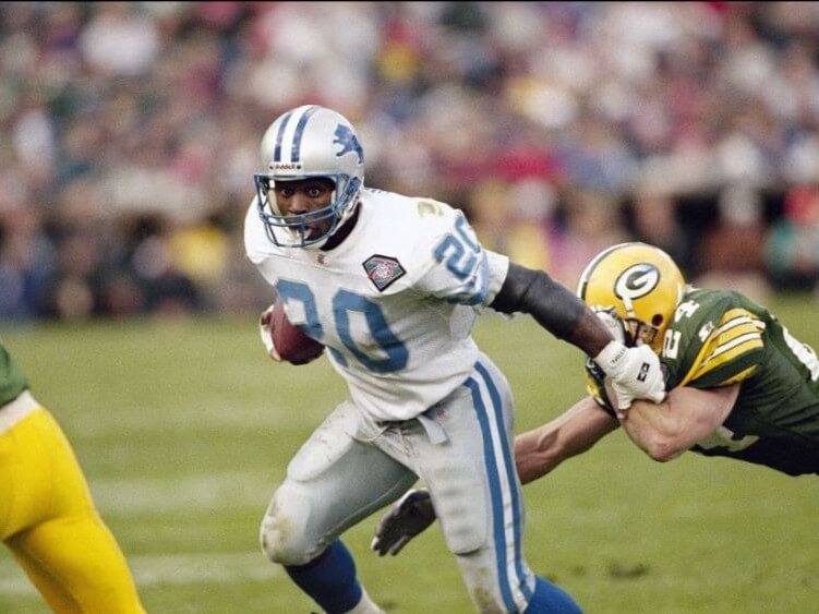 Barry Sanders playing football.